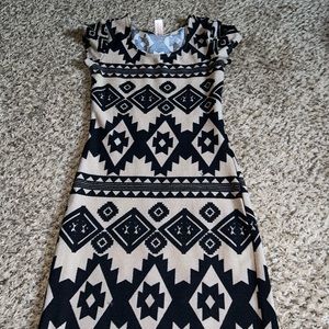 Tight fitting size small dress. Taupe color with bleach designs.
